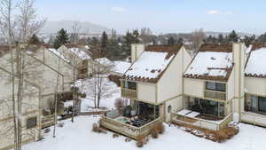 Snowy aerial view with a mountain view