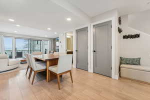 Dining area with light hardwood / wood-style floors