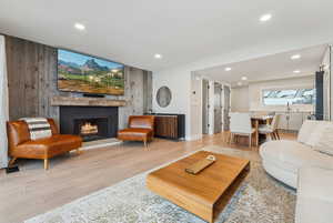 Living room with light hardwood / wood-style floors