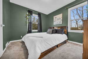 Carpeted bedroom featuring a textured ceiling