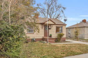 Bungalow with a front lawn