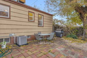 View of patio with area for grilling and cooling unit