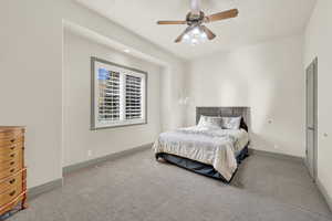 Second Bedroom with light carpet and ceiling fan