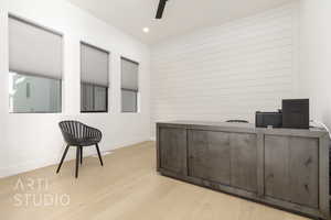 Office featuring ceiling fan and light hardwood / wood-style floors