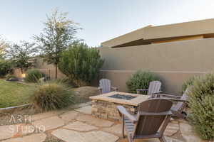 View of patio featuring an outdoor fire pit