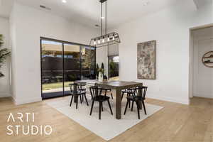 Dining area with recessed lighting, light wood-style flooring, and baseboards