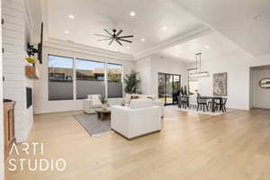 Living room featuring baseboards, ceiling fan, recessed lighting, and light wood-style floors