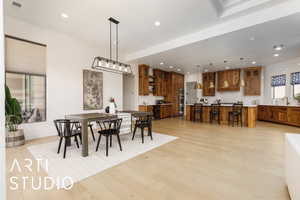 Dining room featuring light wood-style flooring, visible vents, and recessed lighting