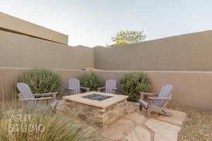 View of patio / terrace with an outdoor fire pit