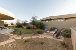 View of yard with a patio and an outdoor fire pit