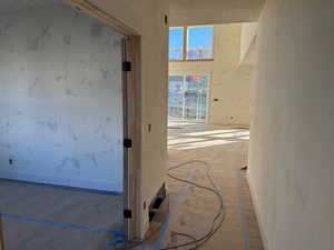 Hall featuring a textured ceiling