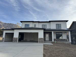 View of front of house featuring a mountain view and covered porch