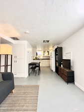 Living room with a textured ceiling