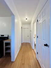 Corridor featuring light hardwood / wood-style flooring