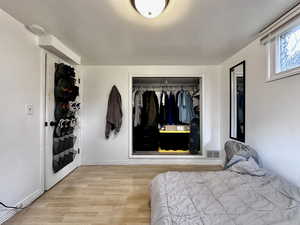 Bedroom featuring a closet and light hardwood / wood-style flooring