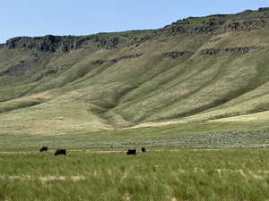 View of mountain background featuring rural landscape