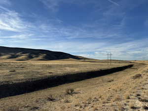 Property view of mountains featuring a rural view