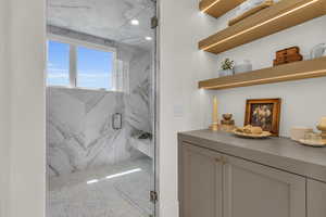 Maser Bathroom with a shower with shower door