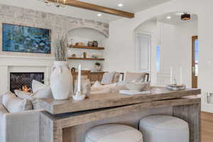 Living room featuring hardwood / wood-style flooring and beamed ceiling