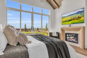 Master Bedroom featuring wooden ceiling, hardwood / wood-style floors, and vaulted ceiling with beams