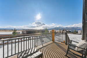 Snow covered balcony above ADU with a beautiful mountain view