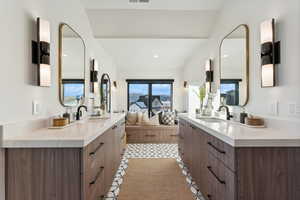 Bunkroom Bathroom with vanity and tile patterned floors