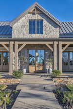 View of exterior entry featuring french doors