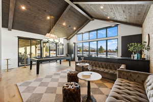 Game room with pool table, wooden ceiling, and light hardwood / wood-style flooring