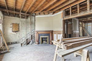 Basement with a tiled fireplace