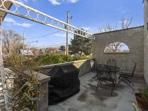 View of patio with grilling area off second floor