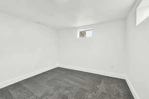 Basement bedroom featuring carpet floors