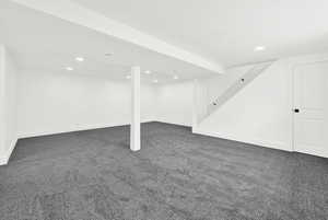 Basement family room with light gray carpet