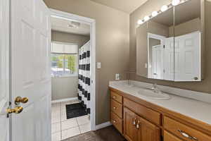 Bathroom featuring vanity and tile patterned floors