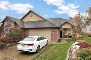 View of front facade with a garage and a front yard