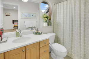 Bathroom featuring vanity and toilet