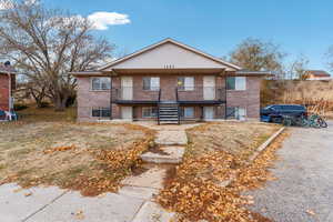 Townhome / multi-family property featuring a porch