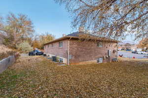 View of side of property with central AC