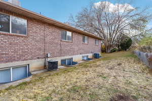 View of home's exterior featuring cooling unit