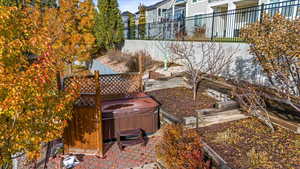 View of yard with a patio and a hot tub