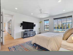 Bedroom with wood-type flooring and ceiling fan