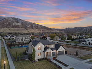 Aerial view at dusk featuring a mountain view