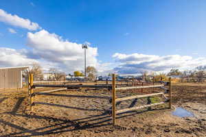 View of yard with a rural view