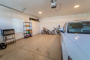 Garage featuring a garage door opener