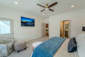 Bedroom featuring ceiling fan and light carpet