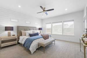 Bedroom with a ceiling fan, recessed lighting, light carpet, and baseboards