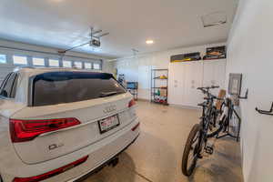 Garage featuring a garage door opener