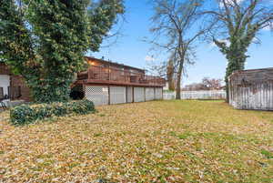 View of yard featuring a deck