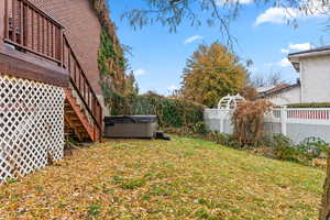 View of yard with a hot tub