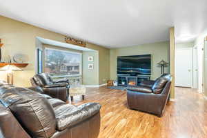 Living room with light hardwood / wood-style floors