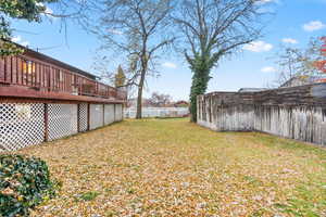 View of yard featuring a wooden deck